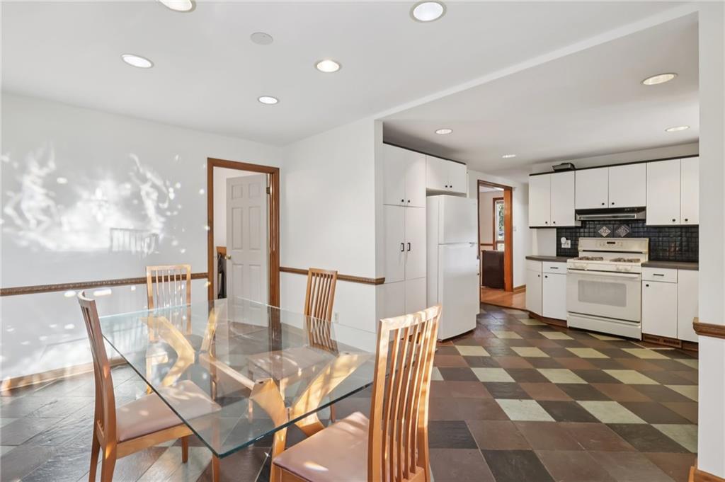 2549 West Hardies Road Gibsonia, PA 15044 - Photo 11 of 34 a kitchen with white cabinets and stainless steel appliances