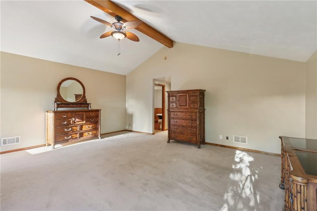 2549 West Hardies Road Gibsonia, PA 15044 - Photo 18 of 34 a view of an empty room with a fireplace and a chandelier