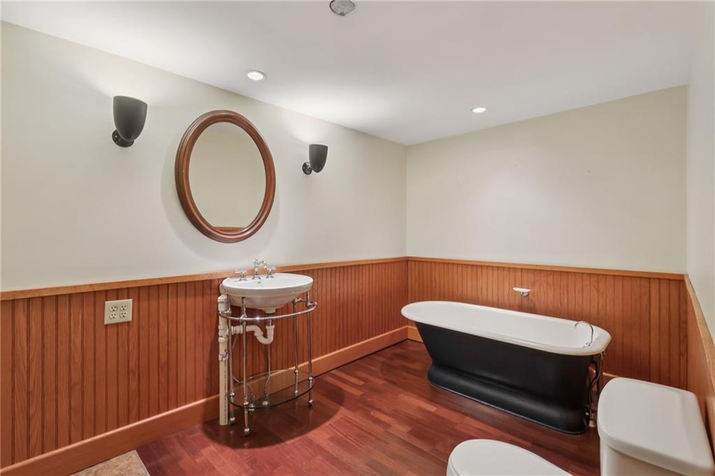 2549 West Hardies Road Gibsonia, PA 15044 - Photo 19 of 34 a bathroom with a toilet a sink and a mirror