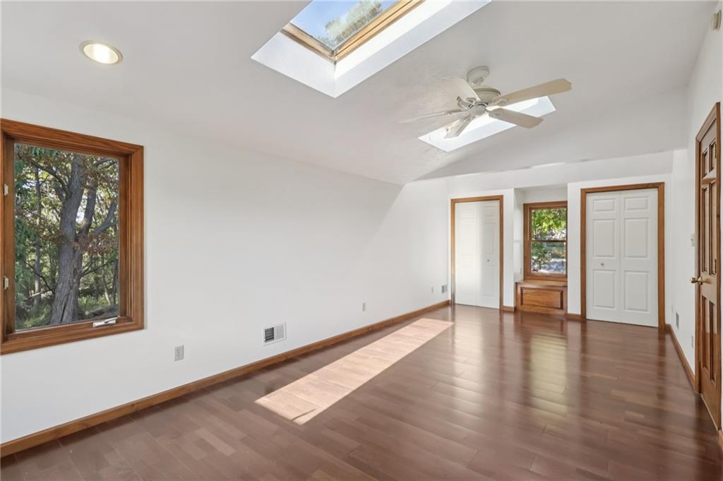 2549 West Hardies Road Gibsonia, PA 15044 - Photo 20 of 34 a view of an empty room with window and wooden floor