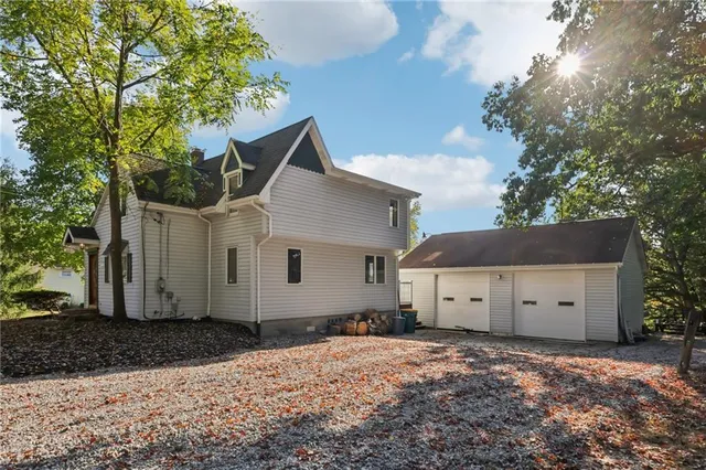 a front view of house with a yard and garage