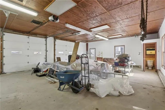a dining room with furniture and a chandelier