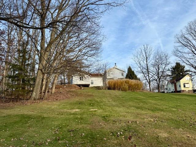 2549 West Hardies Road Gibsonia, PA 15044 - Photo 27 of 34 a view of a yard with a house and a large tree