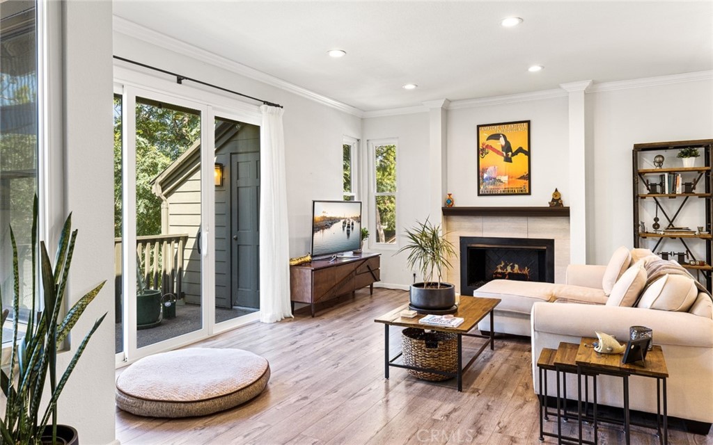 66 Rainbow Ridge, Unit 34 Irvine, CA 92603 - Photo 1 of 1 a living room with furniture and a fireplace