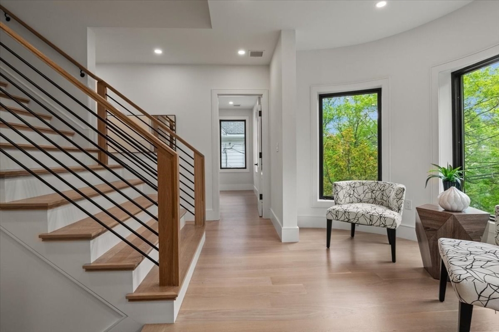 116 Thorndike Street Brookline, MA 02446 - Photo 12 of 42 a living room with furniture and a large window