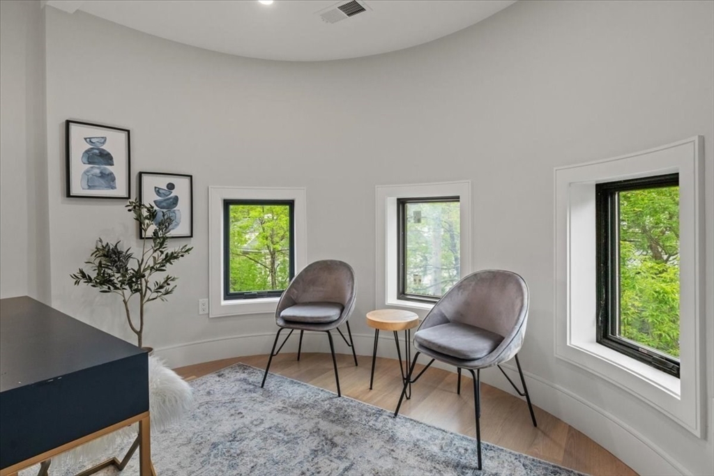 116 Thorndike Street Brookline, MA 02446 - Photo 15 of 42 a work room with furniture and a potted plant