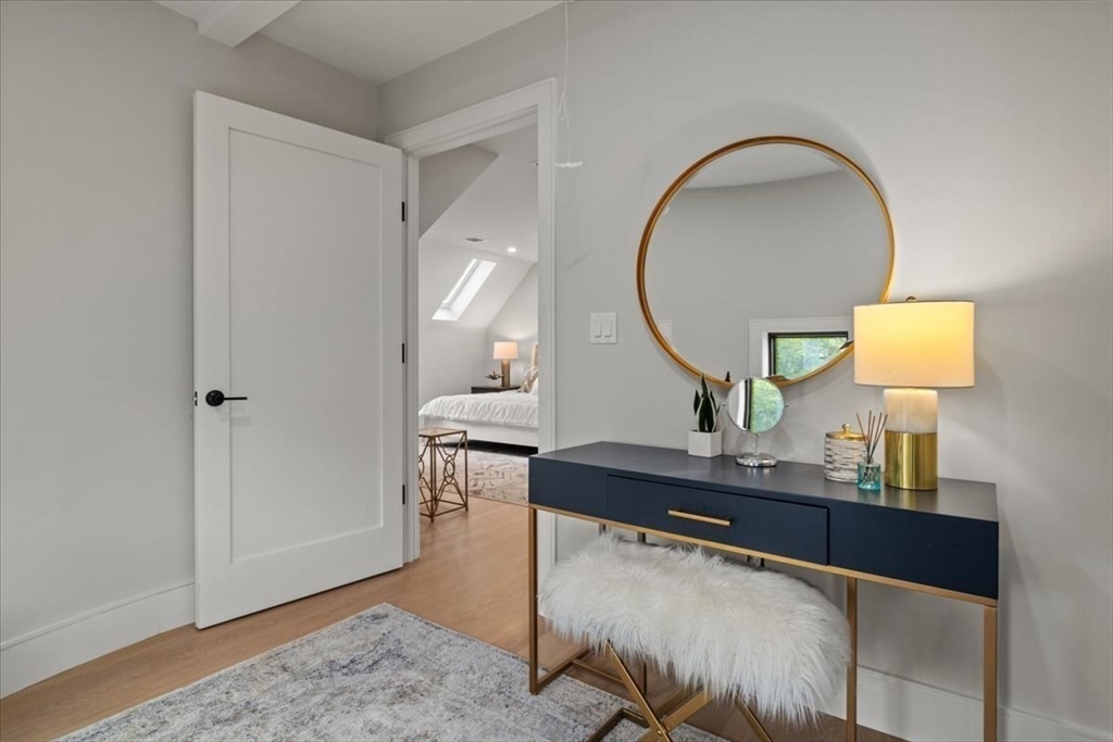 116 Thorndike Street Brookline, MA 02446 - Photo 16 of 42 a view of living room with a table and chairs