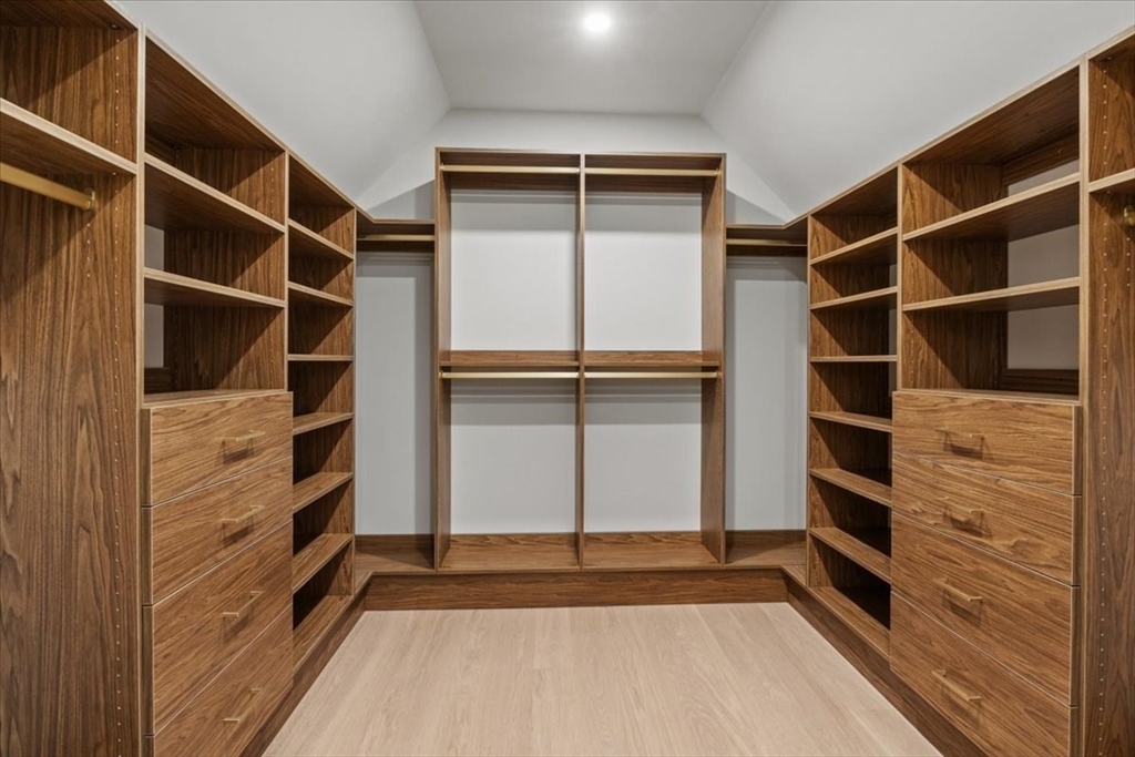 116 Thorndike Street Brookline, MA 02446 - Photo 19 of 42 a view of walk in closet with empty racks