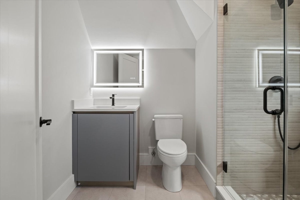 116 Thorndike Street Brookline, MA 02446 - Photo 22 of 42 a bathroom with a toilet sink and shower