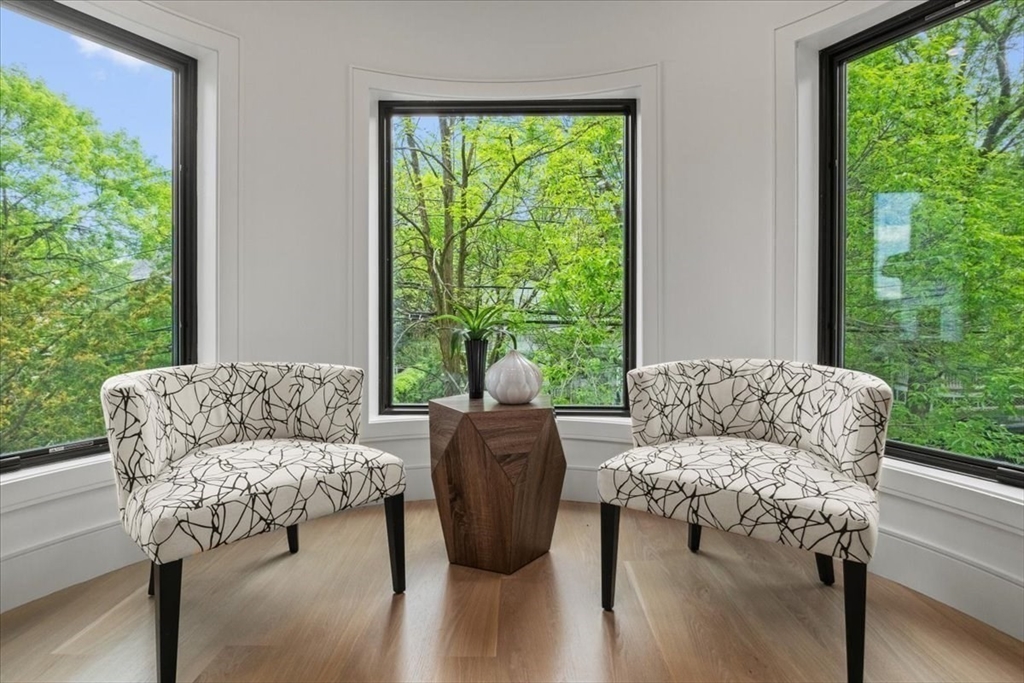 116 Thorndike Street Brookline, MA 02446 - Photo 3 of 42 a living room with furniture and a large window