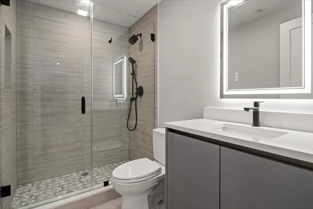 a bathroom with a sink and vanity
