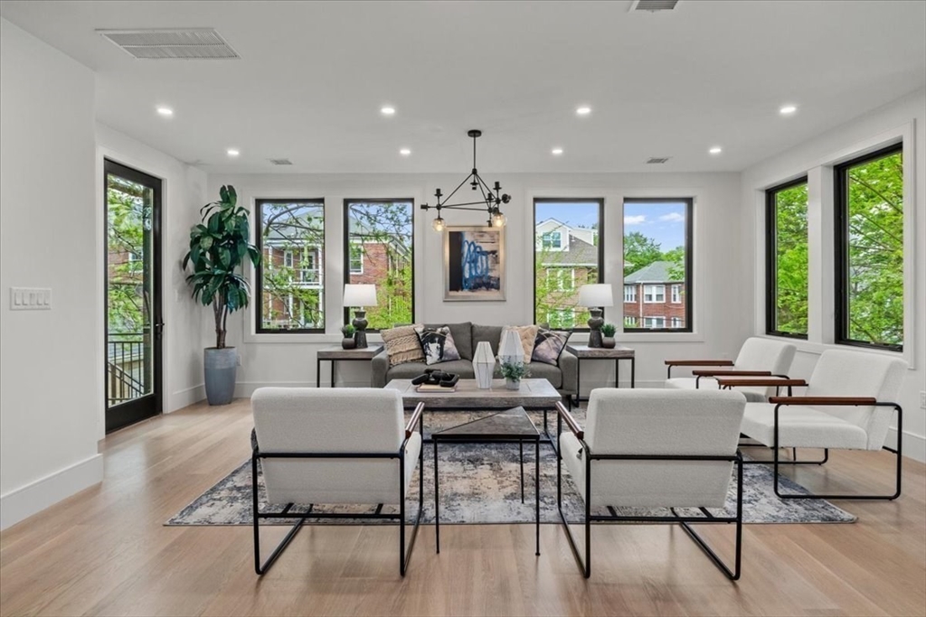 116 Thorndike Street Brookline, MA 02446 - Photo 4 of 42 a living room with furniture and a large window
