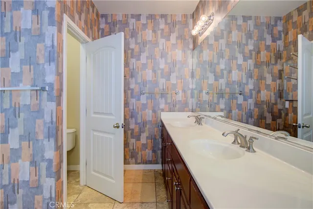 a bathroom with a sink a mirror and a shower