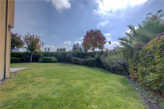 an aerial view of a house with outdoor space