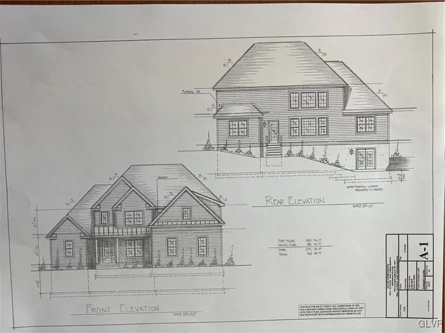 a view of a brick house with large windows