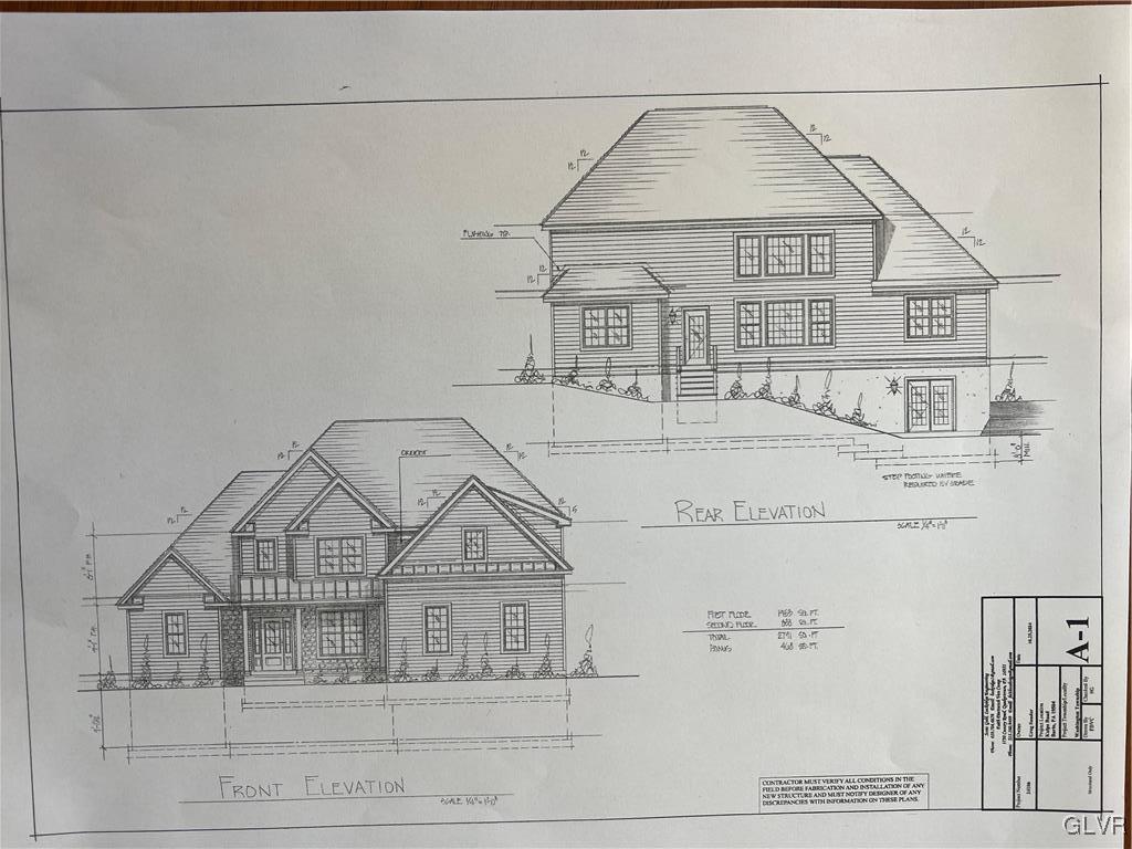 a view of a brick house with large windows