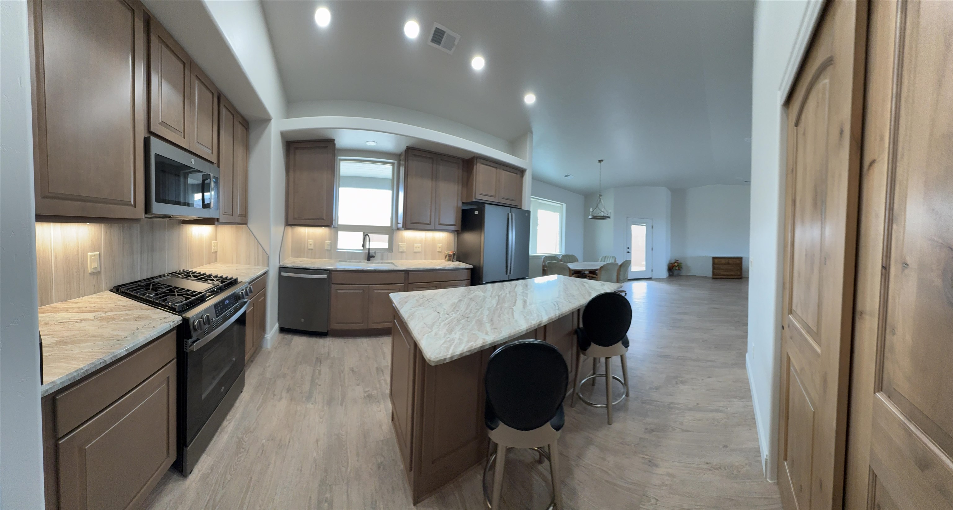 2629 Emerald Ridge Lane Grand Junction, CO 81506 - Photo 13 of 36 a kitchen with a sink stove and refrigerator