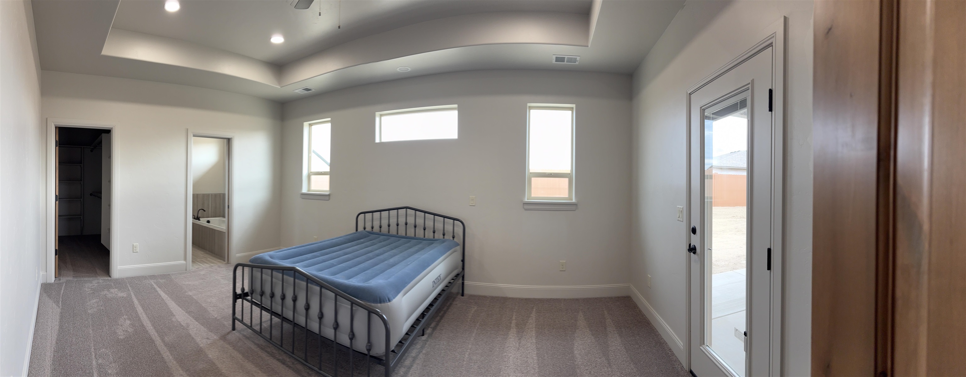 2629 Emerald Ridge Lane Grand Junction, CO 81506 - Photo 15 of 36 a view of a hallway with wooden floor and windows