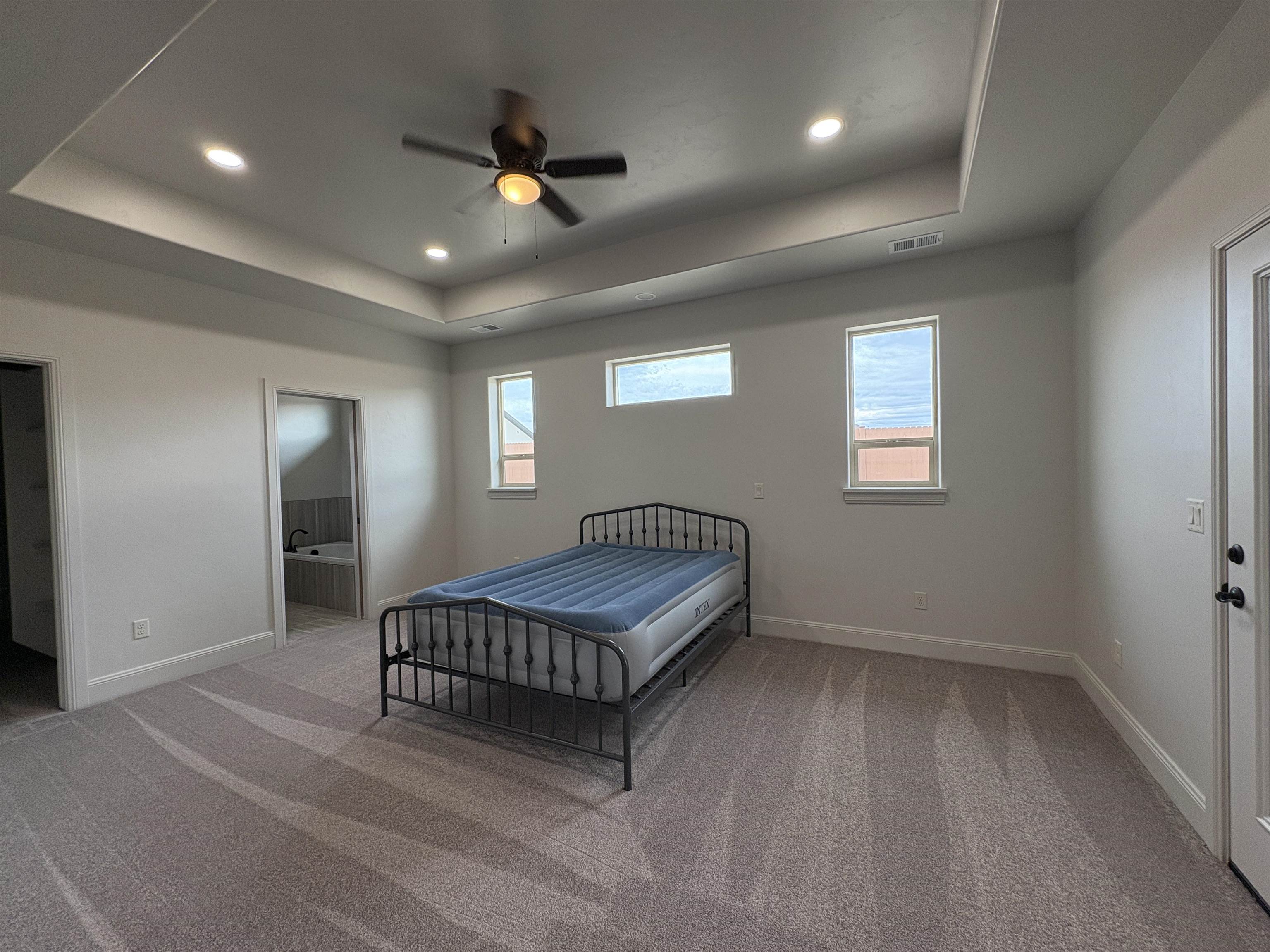 2629 Emerald Ridge Lane Grand Junction, CO 81506 - Photo 16 of 36 a living room with furniture and a ceiling fan