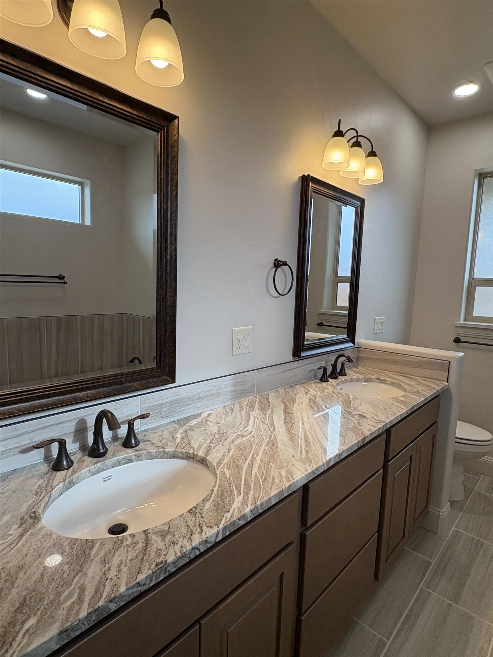 2629 Emerald Ridge Lane Grand Junction, CO 81506 - Photo 19 of 36 a bathroom with a sink and a mirror