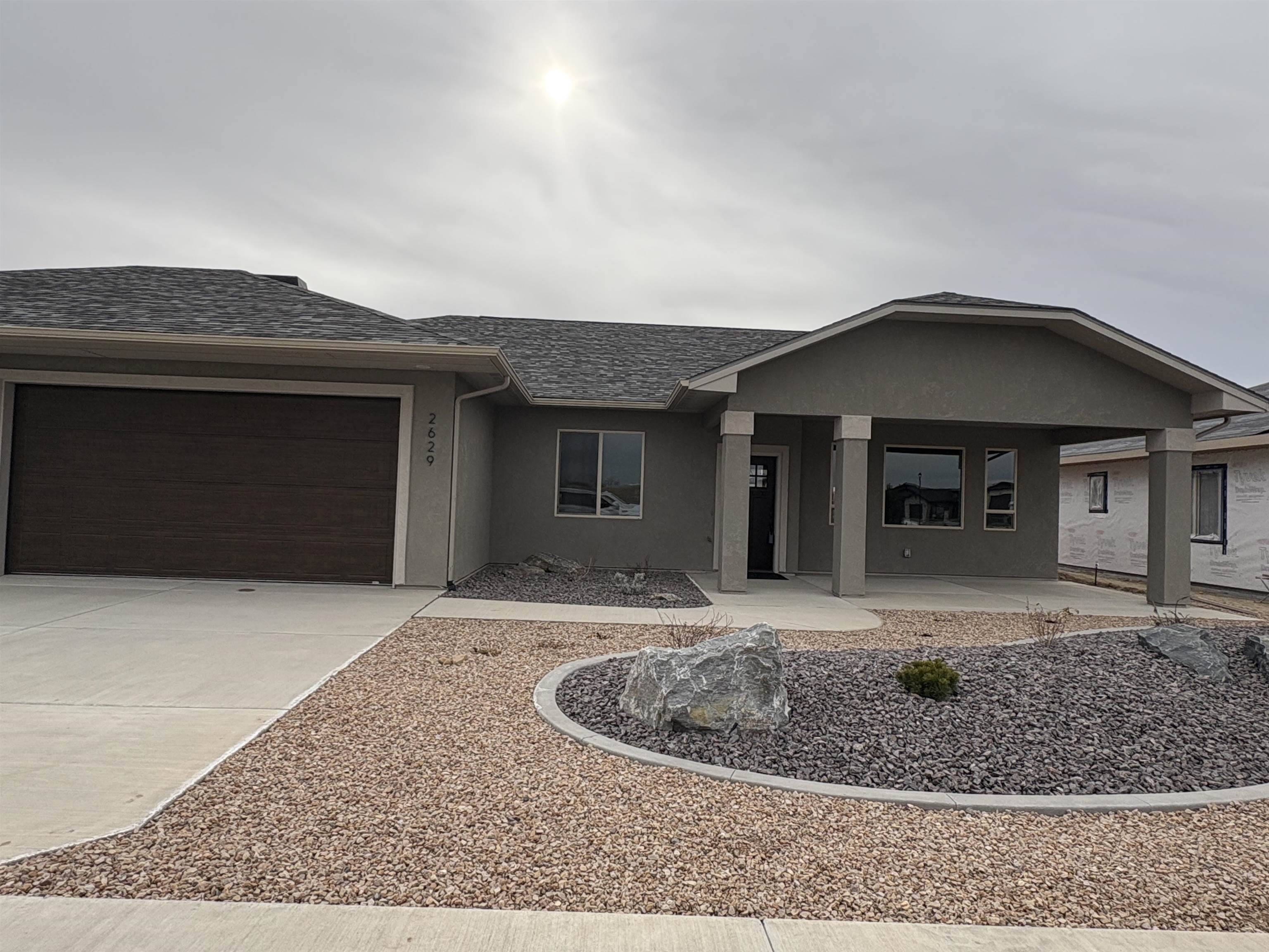2629 Emerald Ridge Lane Grand Junction, CO 81506 - Photo 2 of 36 a view of a house with a small yard