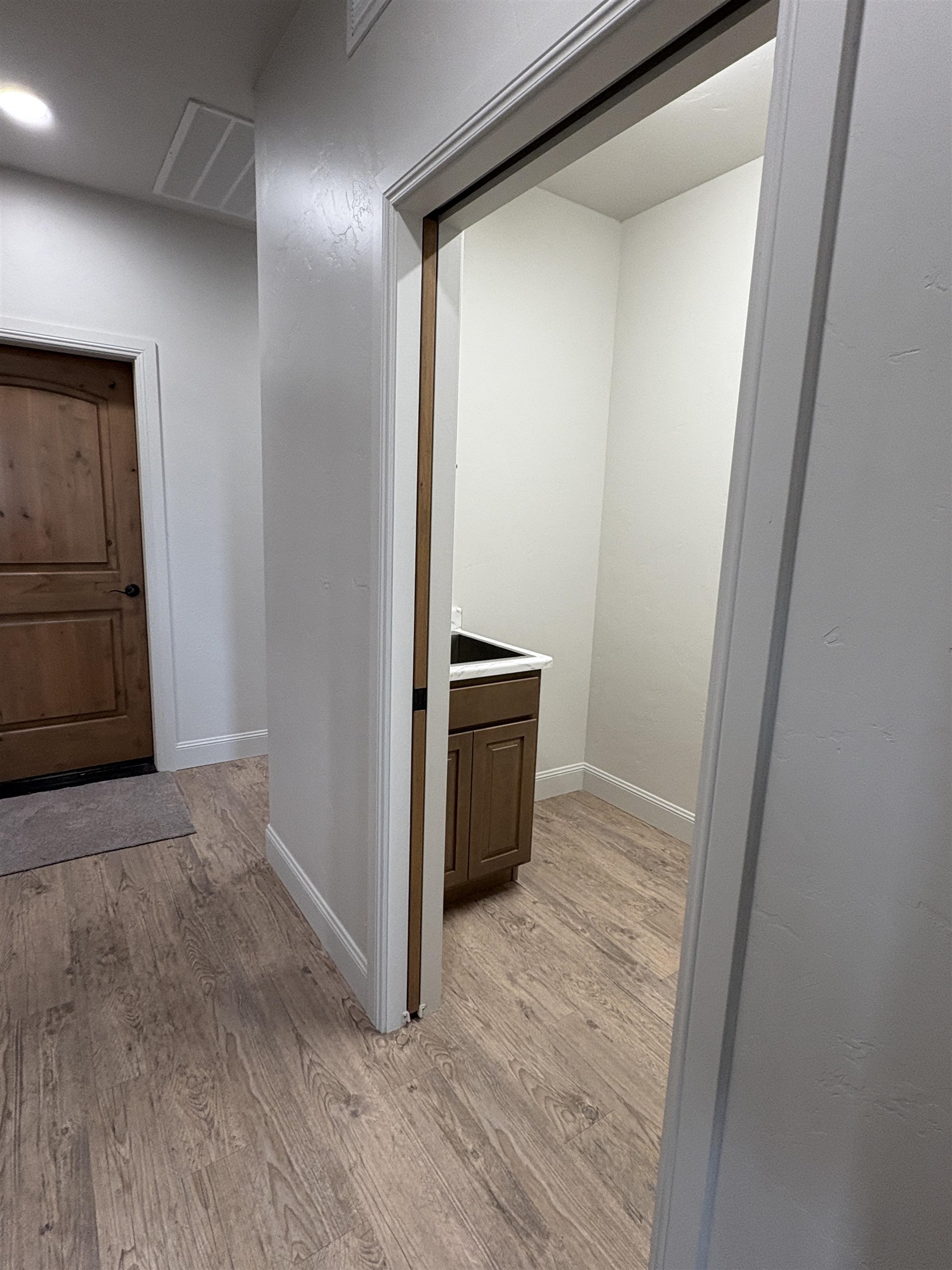 2629 Emerald Ridge Lane Grand Junction, CO 81506 - Photo 31 of 36 a view of hallway with stairs and wooden floor