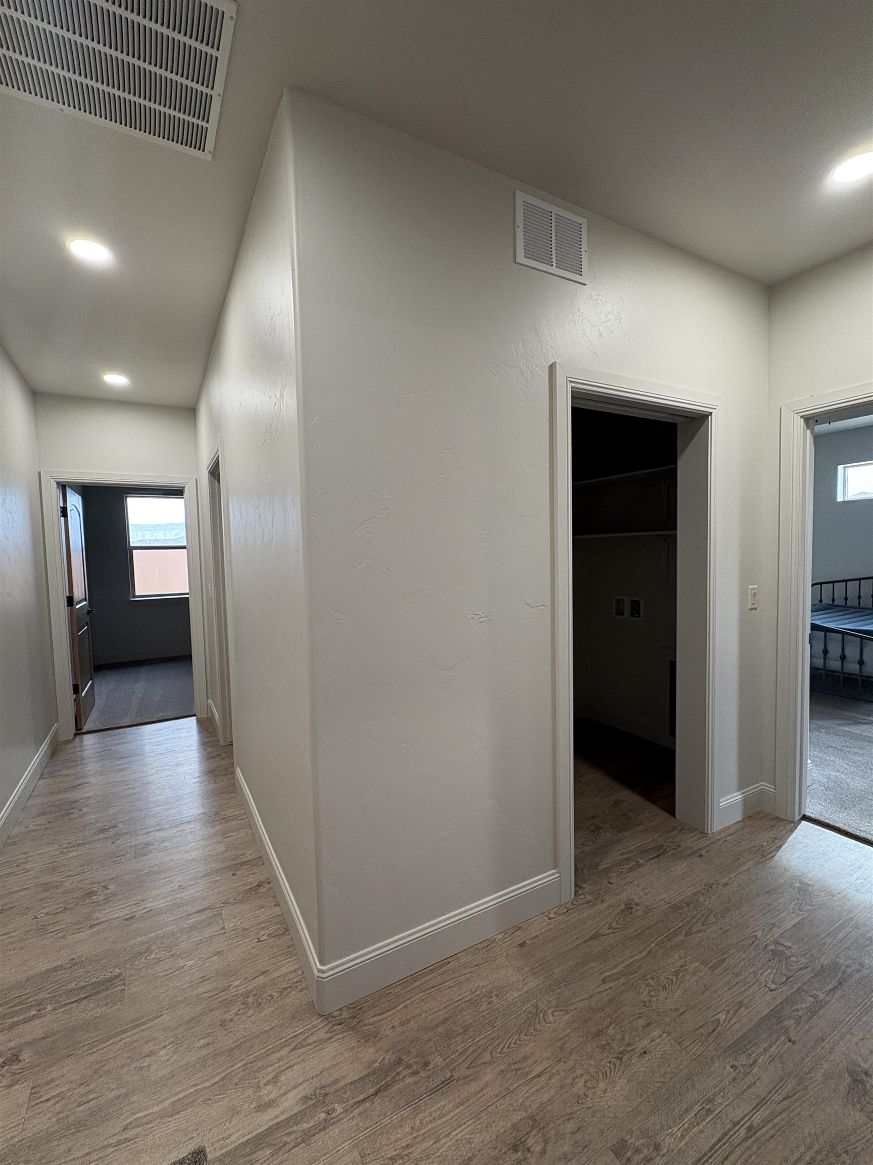2629 Emerald Ridge Lane Grand Junction, CO 81506 - Photo 32 of 36 a view of hallway with wooden floor