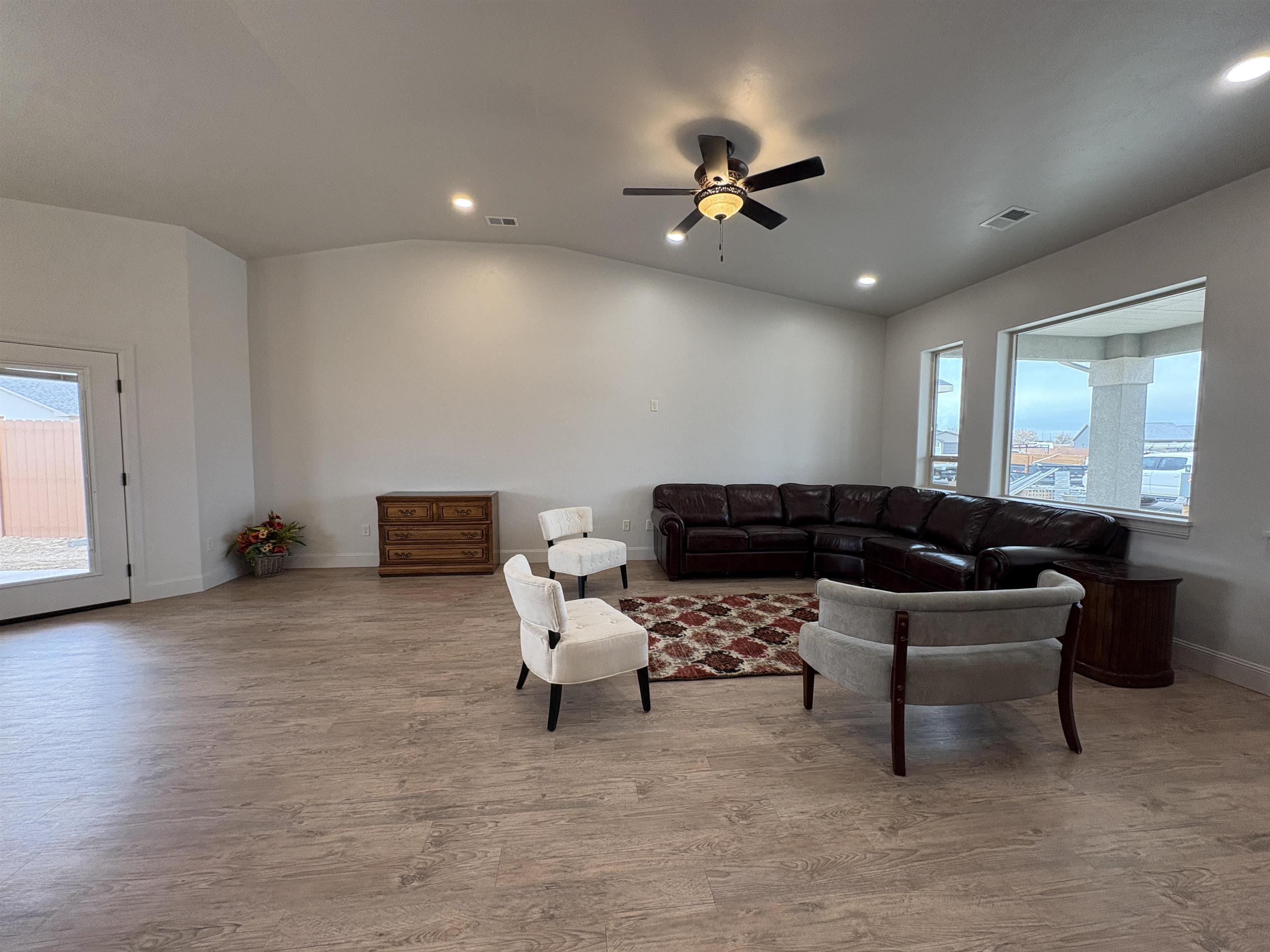 2629 Emerald Ridge Lane Grand Junction, CO 81506 - Photo 7 of 36 a living room with furniture and a ceiling fan