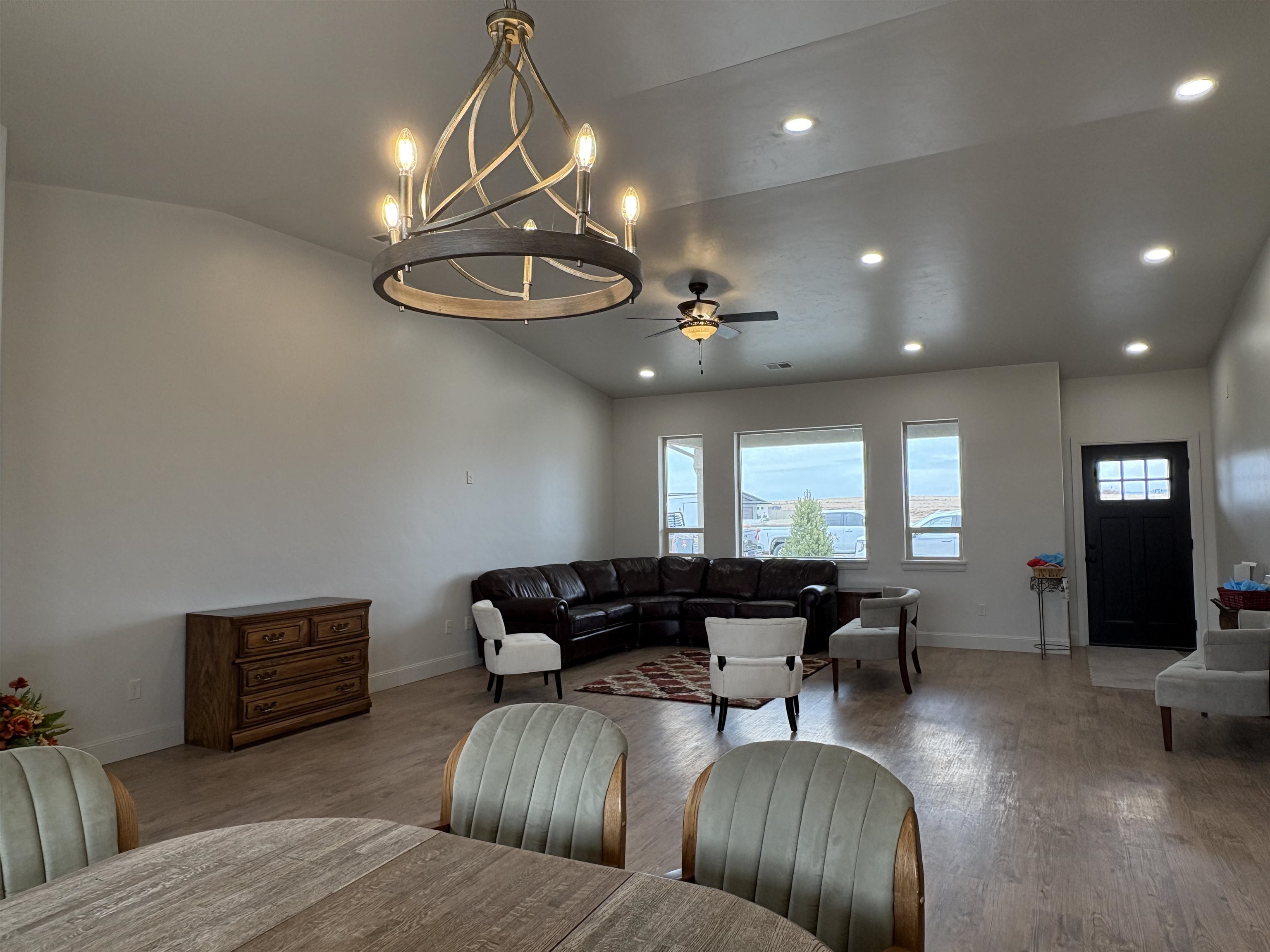 2629 Emerald Ridge Lane Grand Junction, CO 81506 - Photo 9 of 36 a living room with furniture and a chandelier