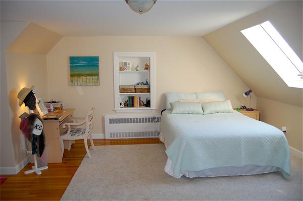 39 Shetland Road Marblehead, MA 01945 - Photo 8 of 12 a bedroom with a bed and a chandelier
