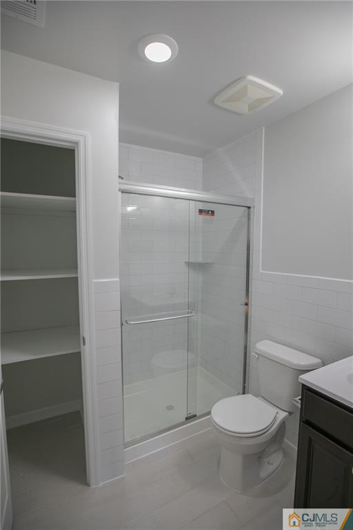 3405 Hana Road Edison, NJ 08817 - Photo 52 of 69 a bathroom with a toilet and a shower