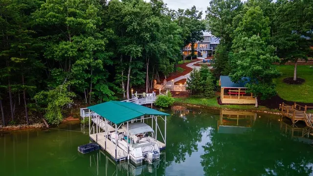 an aerial view of a house with outdoor space pool seating area and yard