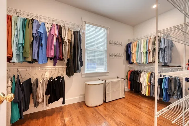 a bathroom with a granite countertop toilet sink and mirror