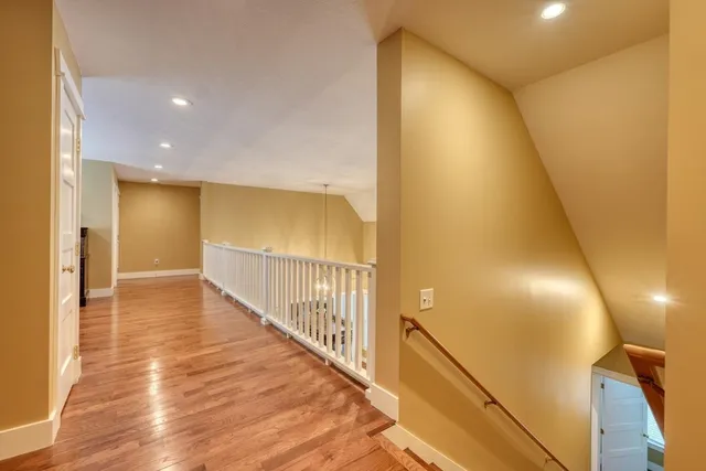 a view of a hallway to a livingroom and a livingroom with furniture