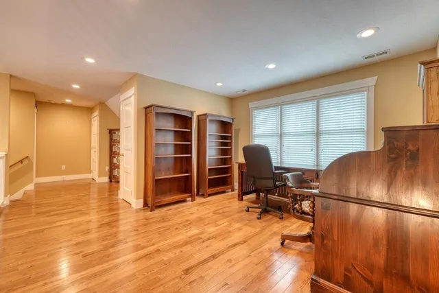 a bathroom with a granite countertop sink a vanity and a mirror