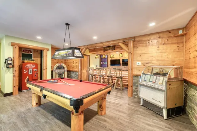 a view of a house with sitting area and wooden floor