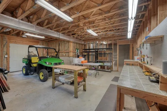 an aerial view of a house with a yard basket ball court and outdoor seating