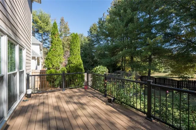 a balcony with trees in front of it