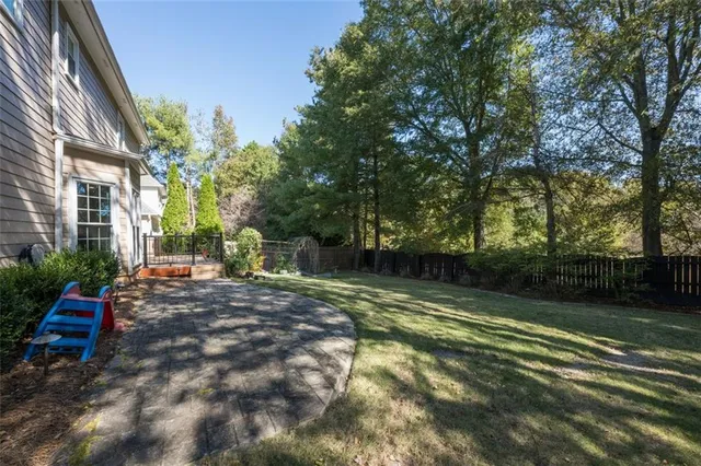 a view of backyard with trampoline