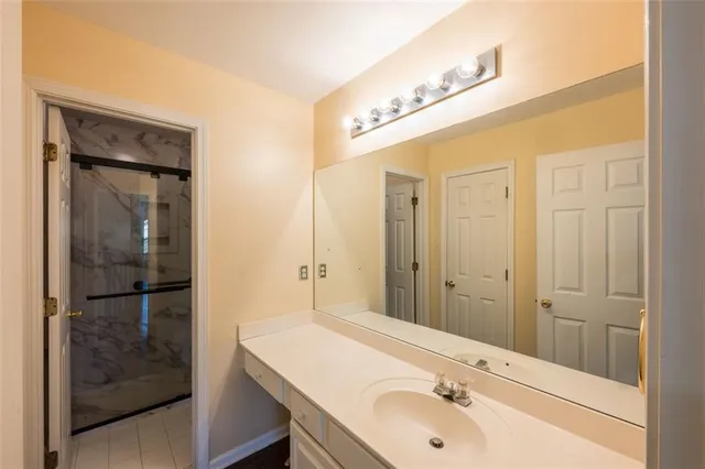 a bathroom with a sink and a mirror