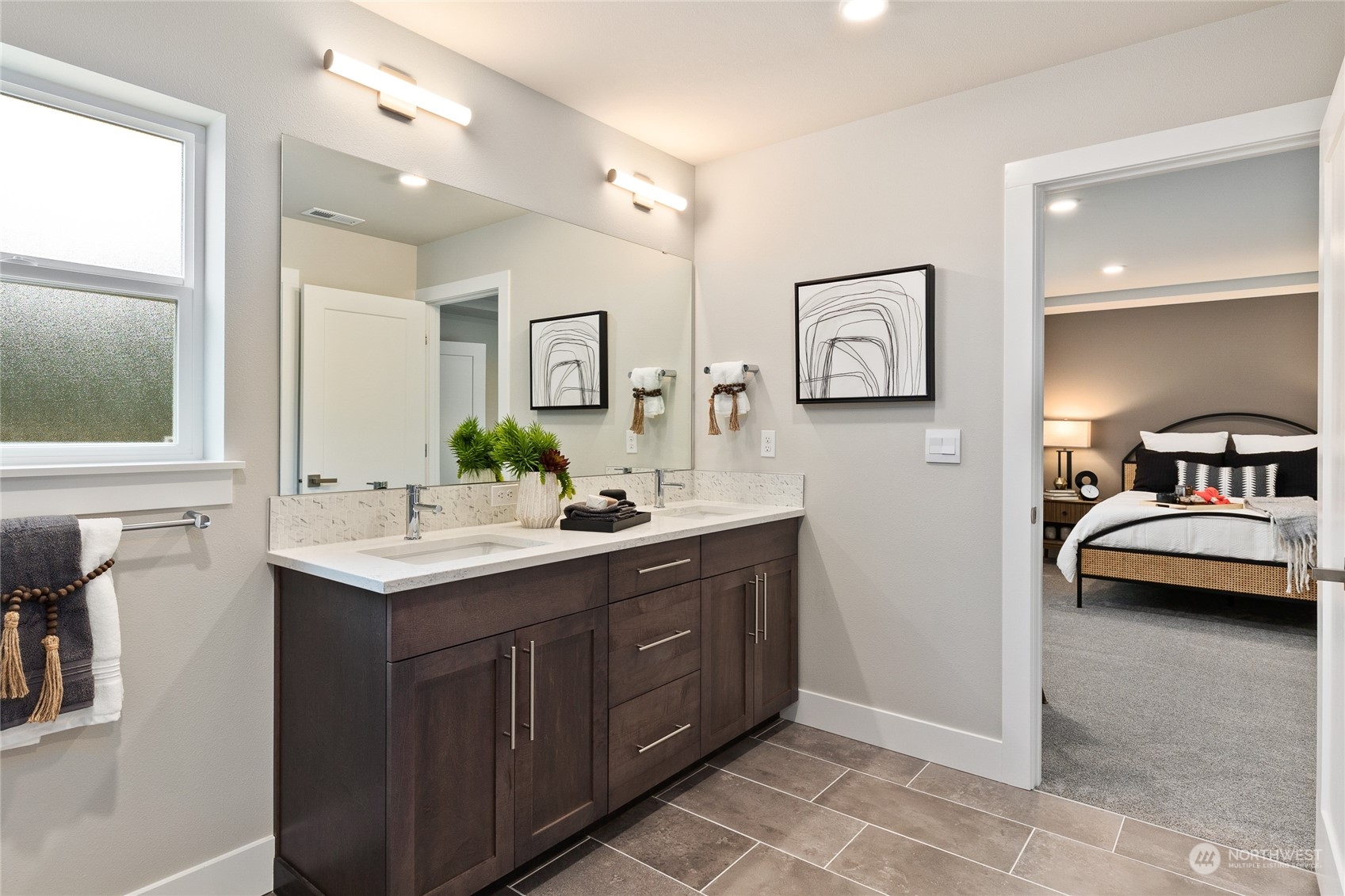 3810 198th Place Southeast Bothell, WA 98012 - Photo 21 of 32 a en suite bathroom with a double vanity sink and a mirror