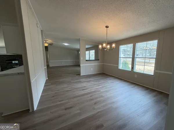 a view of livingroom and kitchen with hardwood floor
