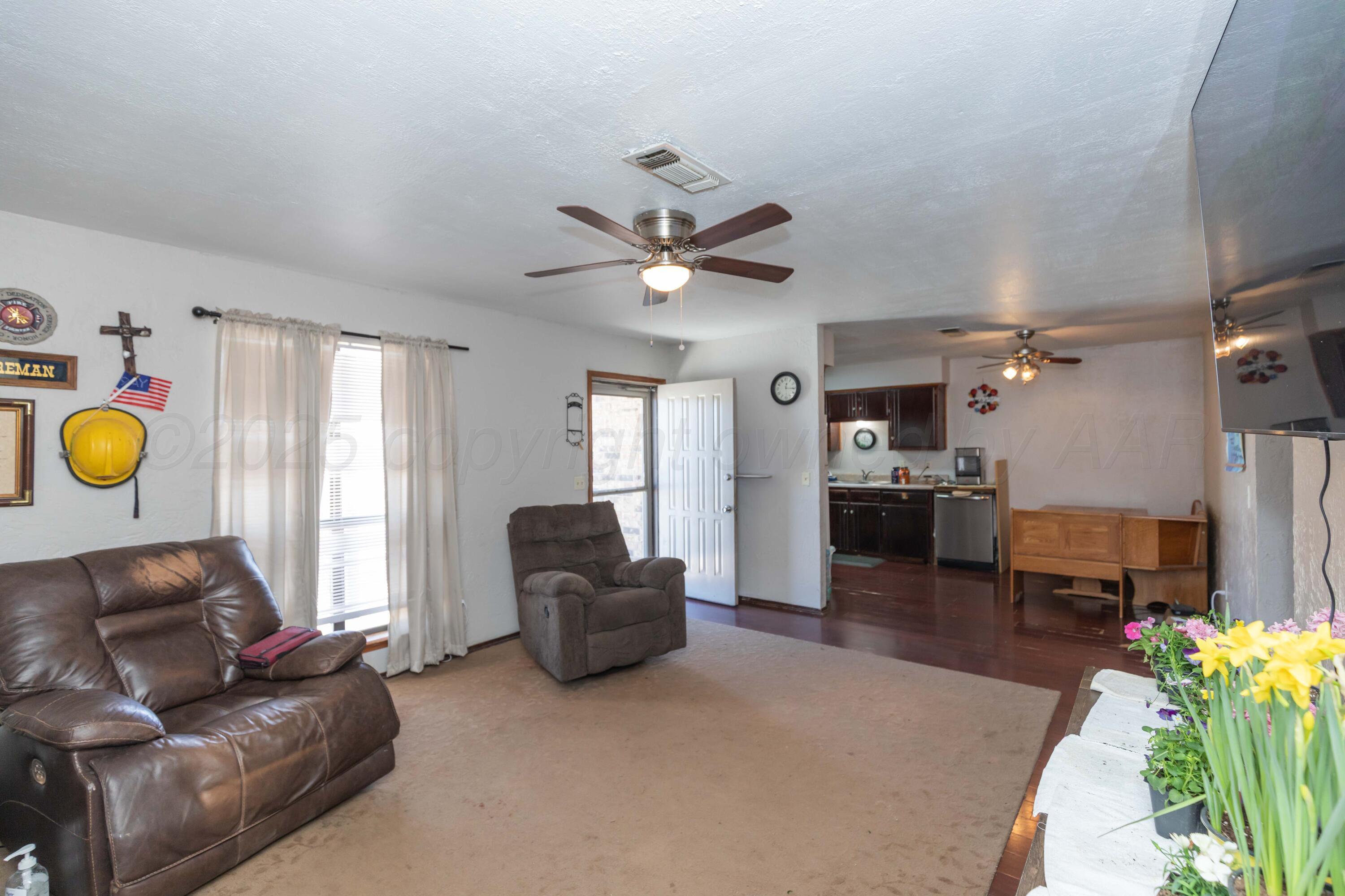 609 Groom Avenue Panhandle, TX 79068 - Photo 11 of 28 a living room with furniture and kitchen appliances