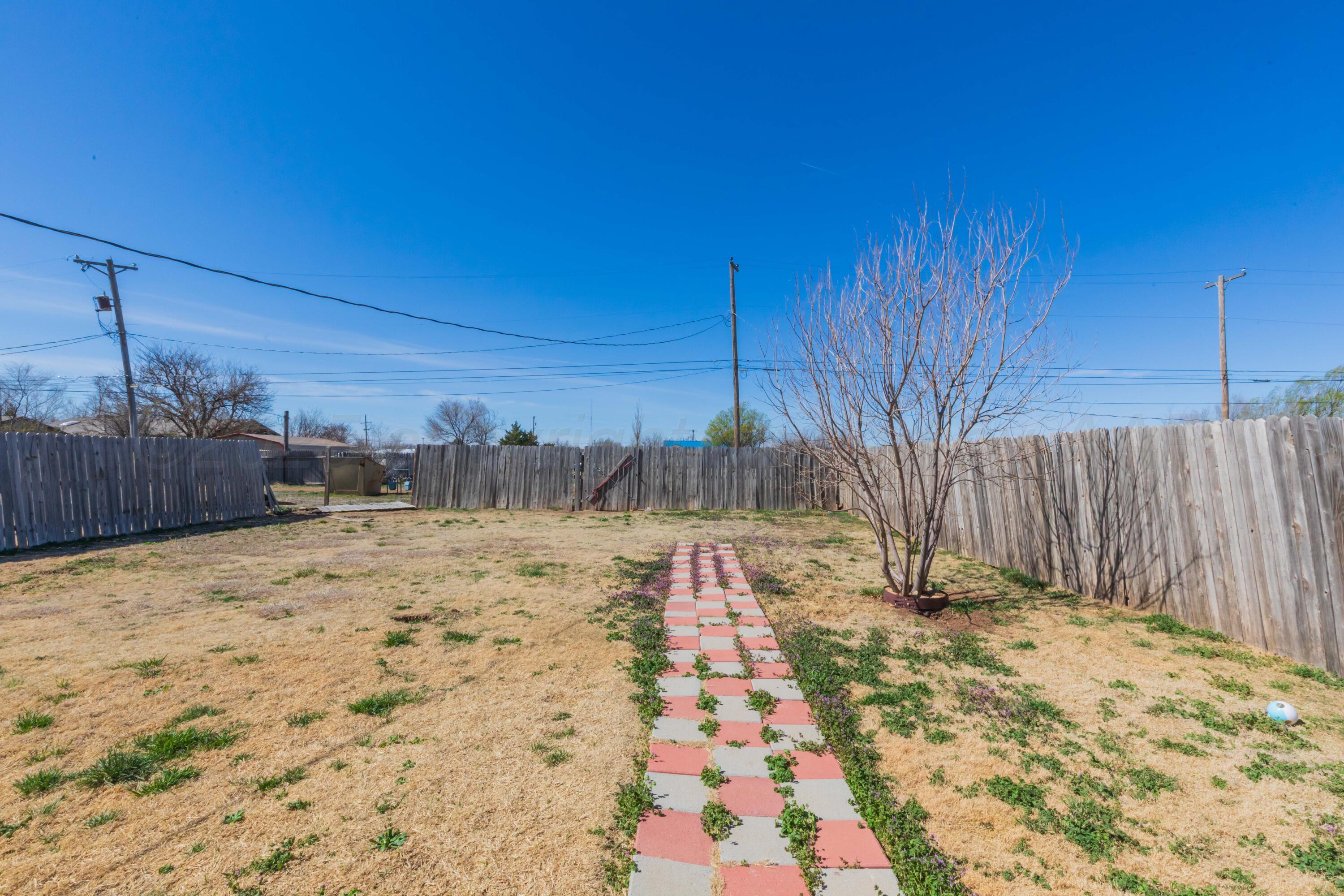 609 Groom Avenue Panhandle, TX 79068 - Photo 27 of 28 a view of a yard with wooden fence