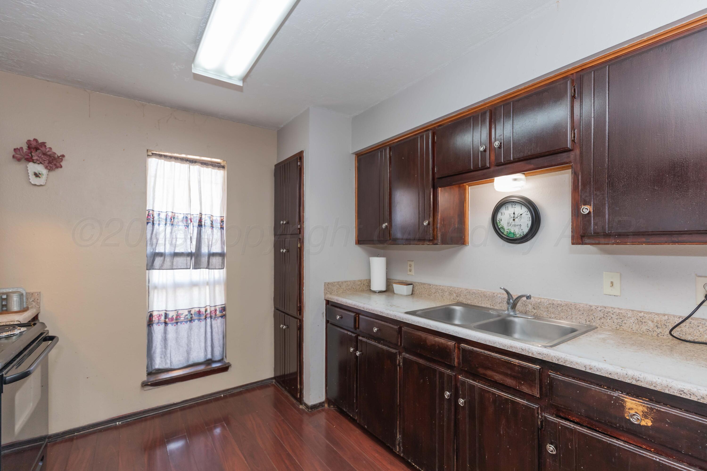 609 Groom Avenue Panhandle, TX 79068 - Photo 5 of 28 a bathroom with a sink and a mirror