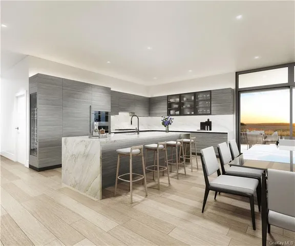 a dining room with furniture and a floor to ceiling window