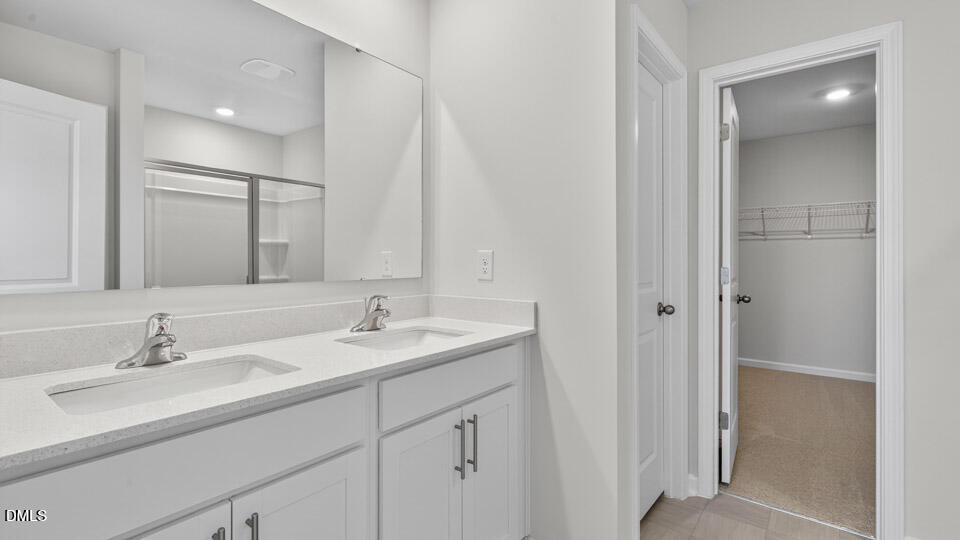 181 Fair Child Road Spring Lake, NC 28390 - Photo 29 of 43 a bathroom with a sink and a mirror
