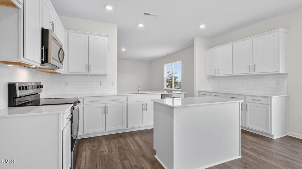 181 Fair Child Road Spring Lake, NC 28390 - Photo 10 of 43 a kitchen with cabinets appliances a sink and a counter space