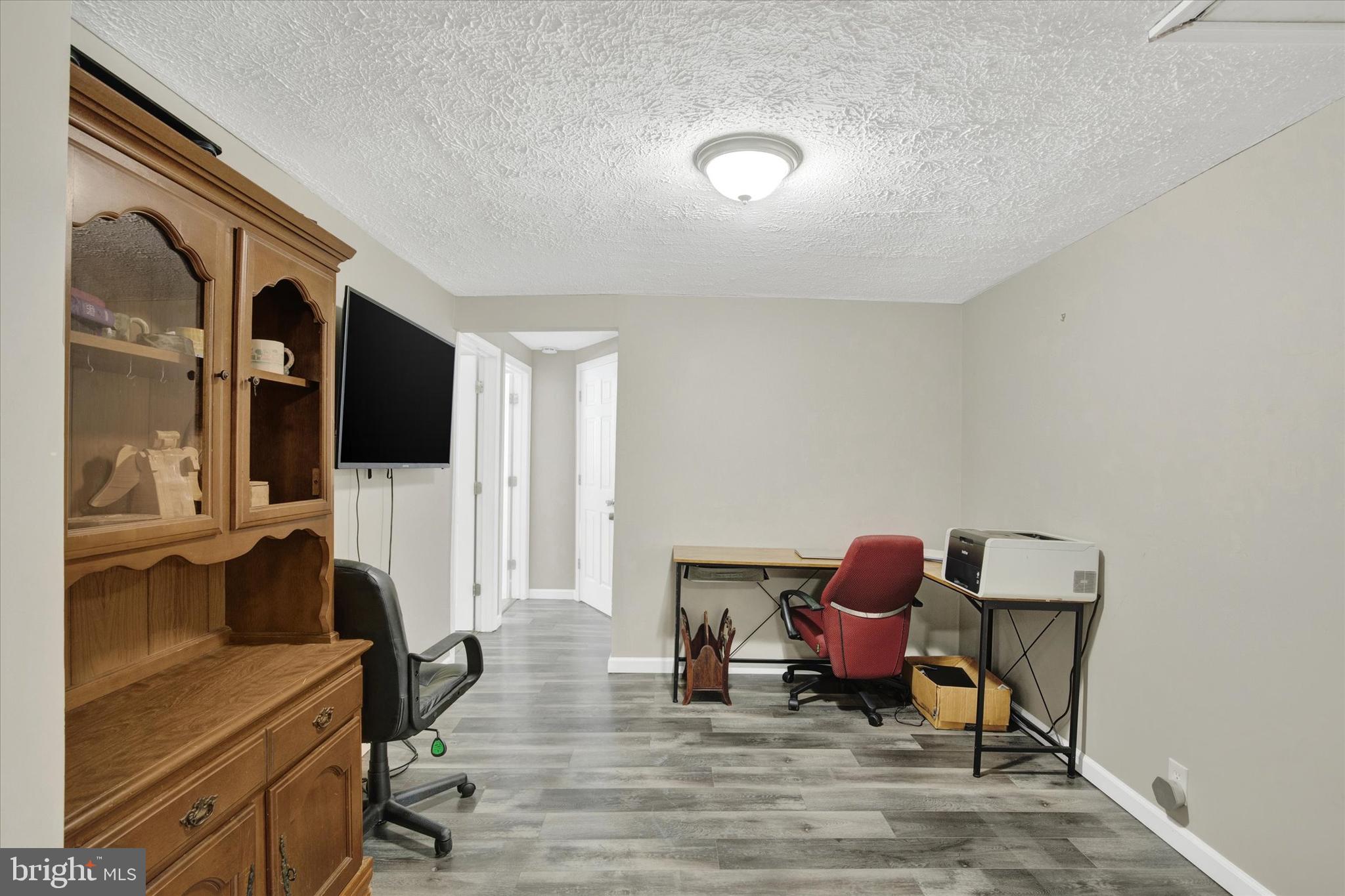 228 Porters Bridge Road Colora, MD 21917 - Photo 10 of 29 a living room with furniture and a flat screen tv