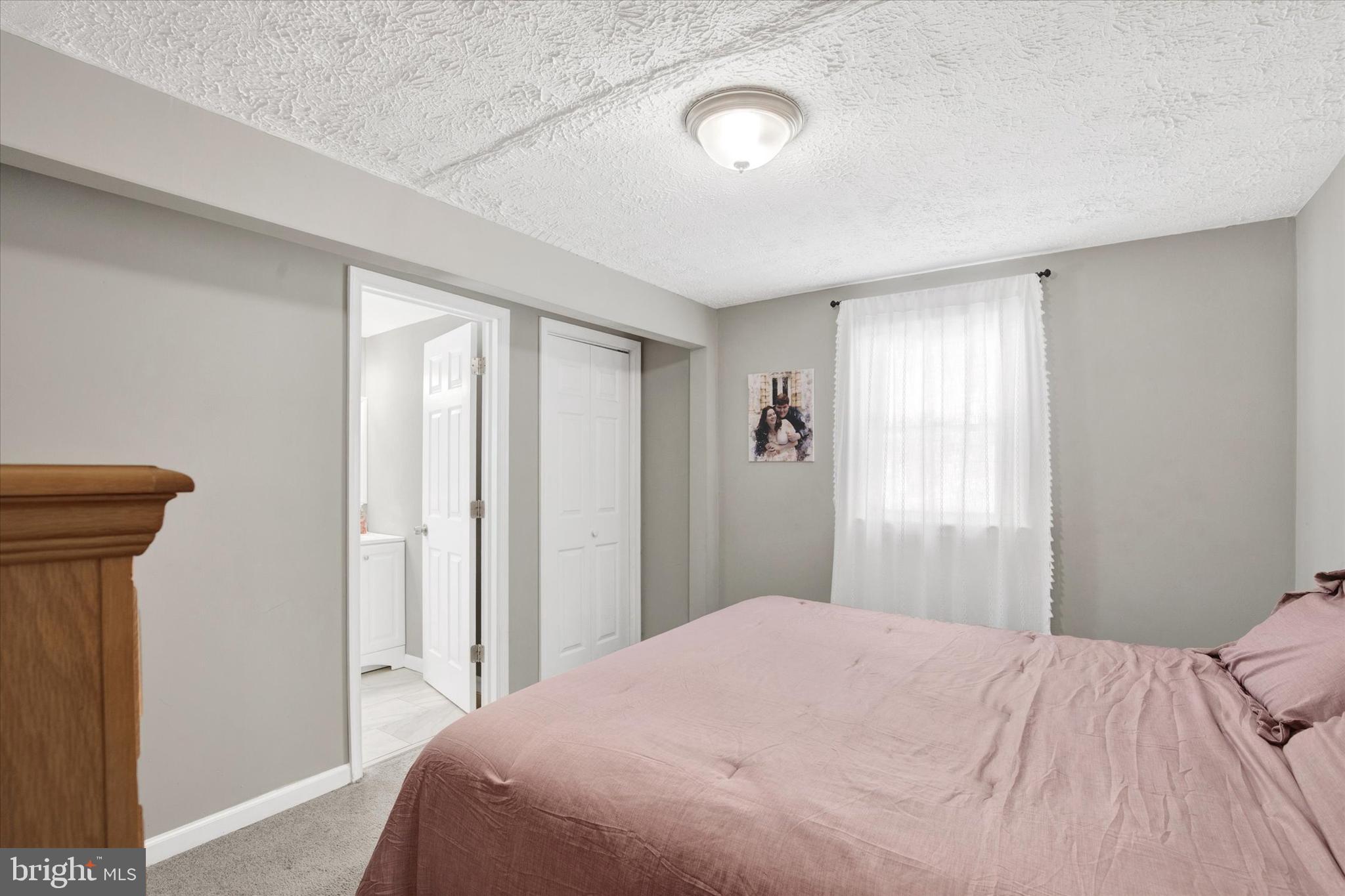 228 Porters Bridge Road Colora, MD 21917 - Photo 12 of 29 a bedroom with a bed and a window